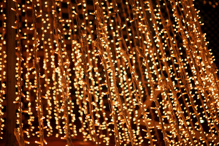 Christmas decorations in the street with golden lights