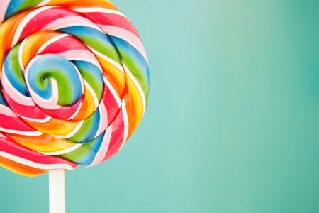 Nice round lollipop with many colors in a spiralの写真素材