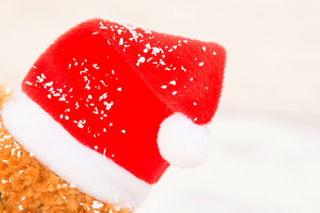 Cute teddy bear with red hat. Christmas atmosphereの写真素材