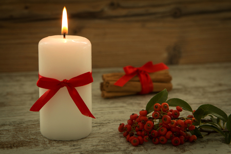 Elegant candles decorated for Christmas. Brighten up your illusionの写真素材