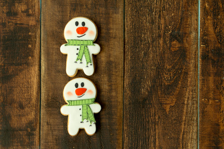 Delicious Christmas cookies on a wooden tableの写真素材