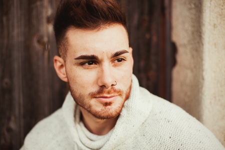 Attractive guy in a old house with white jerseyの写真素材