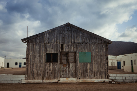 Old wooden house for fishermen with three windowsの写真素材