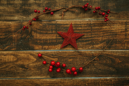Red Christmas star on a rustic wooden backgroundの写真素材