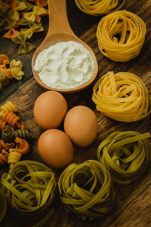 different types of colored pasta with various shapesの写真素材