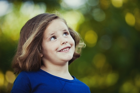 Cute little girl on the park in summer dayの写真素材