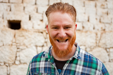 Portrait of a red haired man in a rural enviromentの写真素材