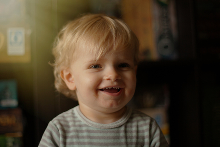 Adorabla baby with one year old wearing pijama at home