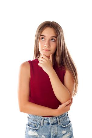 Pensive teenager girl isolated on a white backgroundの写真素材
