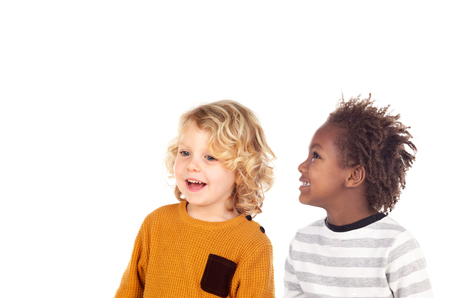 Two small children laughing isolated on a white backroundの写真素材