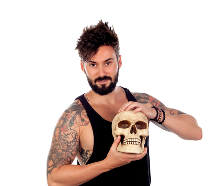 Dark guy with a human skull isolated on a white backgroundの写真素材