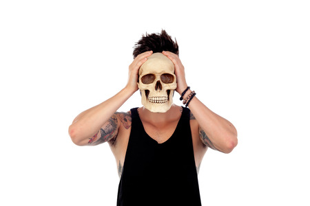 Dark guy with a human skull isolated on a white background