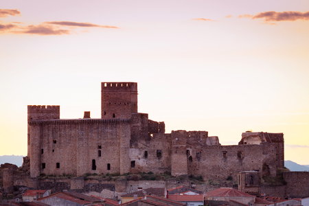 Silhouette of a amazing castle over a yellow skyのeditorial素材