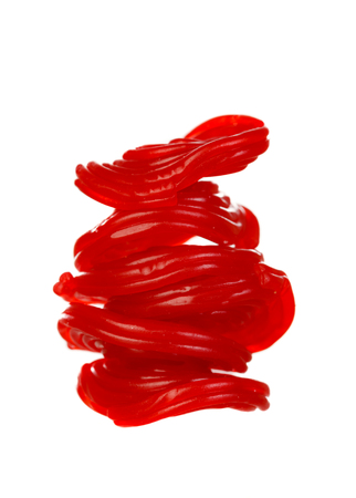 Red licorice candy spirals isolated on white background