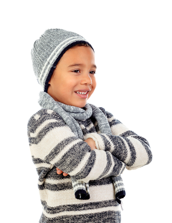 Beautiful child with wool scarf isolated on a white backgroundの写真素材
