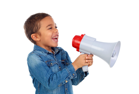 Small boy shouting through a megaphone isolated on white backgroundの写真素材