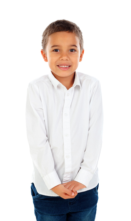 Shy small child with dark hair and black eyes isolated on a white backgroundの写真素材