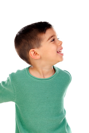 Pensive child with green t-shirt looking up isolated on a white backgroundの写真素材