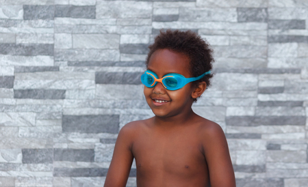 Little african child with swimming gogglesの写真素材