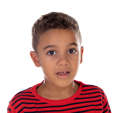 Beautiful latin child with red striped shirt isolated on a white backgroundの写真素材