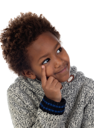 Adorable afroamerican child thinking isolated on a white backgroundの写真素材
