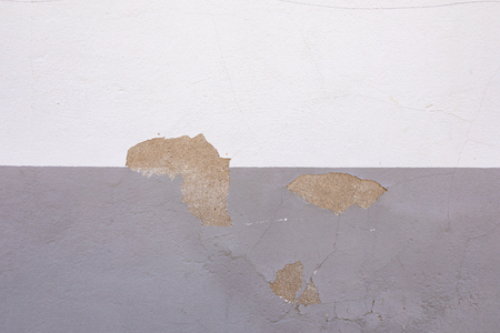Chipped wall with two types of paint for use wallpaperの写真素材
