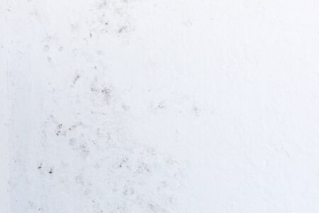 Crack in a white wall with cement brick surfaceの写真素材