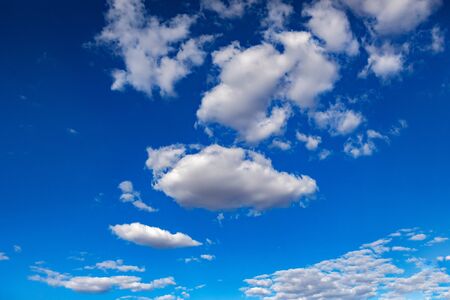 Fluffy clouds decorating a beautirful blue sky