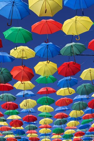 Colorful umbrellas on the sky to give shadow for the streetの写真素材