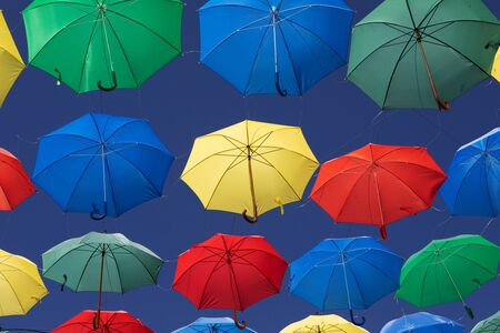 Colorful umbrellas on the sky to give shadow for the streetの写真素材