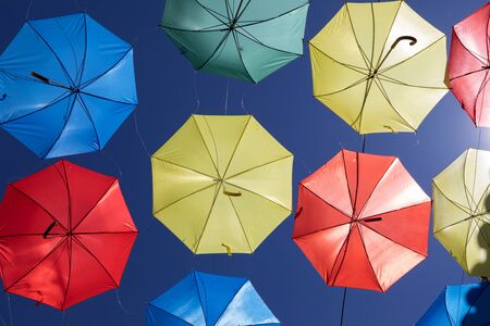 Colorful umbrellas on the sky to give shadow for the streetの写真素材
