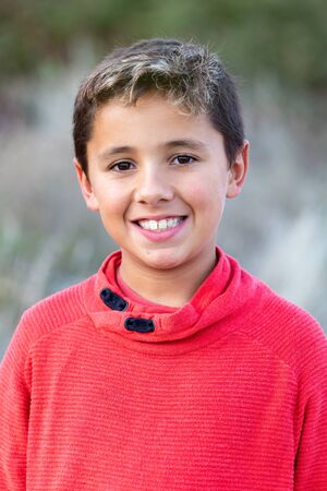 Happy guy twelve years old with red jersey