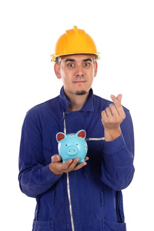 Construction worker with yellow helmet and moneybox isolated on a white backgroundの写真素材