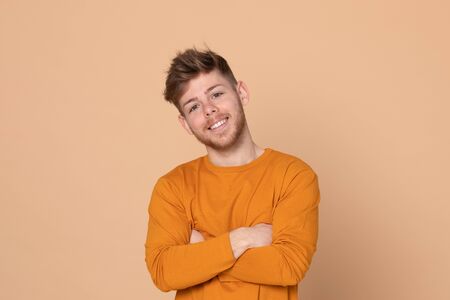 Attractive young guy on a yellow background