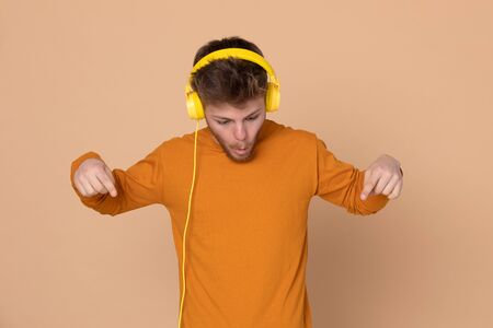 Attractive young guy on a yellow background