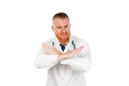 Redhead doctor with a medical gown isolated on a white backgroundの写真素材