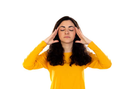 Adorable teenage girl with yellow sweater isolated on a white background