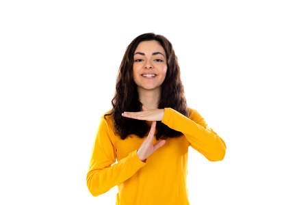 Adorable teenage girl with yellow sweater isolated on a white background