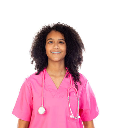 Adorable little doctor with pink uniform isolated on a white backgroundの写真素材