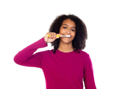 Teenager girl with afro hair wearing pink sweater isolated on a white backgroundの写真素材