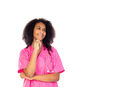 Adorable little doctor with pink uniform isolated on a white backgroundの写真素材