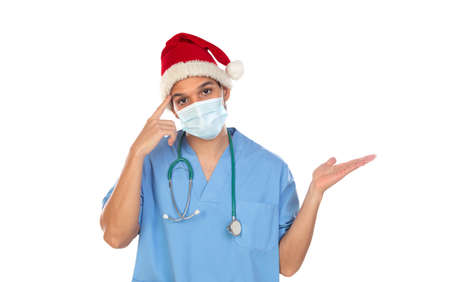 African doctor wearing a Christmas hat at coronavirus time isolated on a white backgroundの写真素材