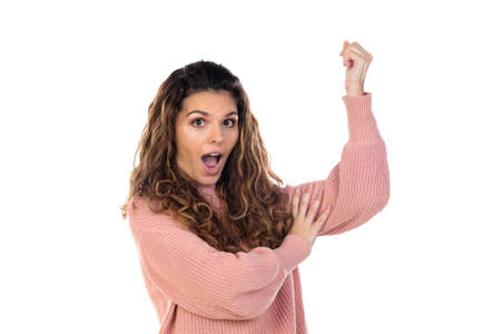 Beautiful middle aged woman with pink woolen sweater isolated on a white backgroundの写真素材