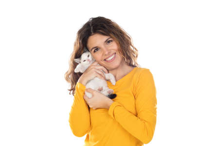 Cute young woman holding her cat isolated on a white backgroundの写真素材