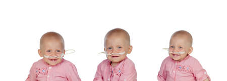 Adorable baby with a headscarf beating the diseaseの写真素材