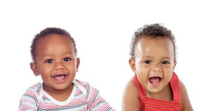 Two funny babies laughing isolated on a white backgroundの写真素材
