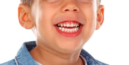 Beautiful smile of a little child with dark skin. Teeth close up
