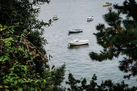 Beautiful views of the Spanish north coast with small boatsの写真素材