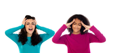 Two cheerful women friends girls isolated on a white backgroundの写真素材