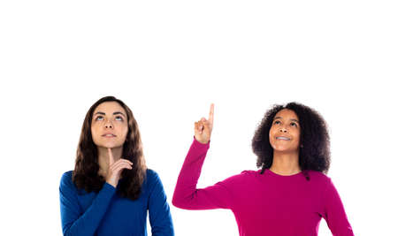 Two cheerful women friends girls isolated on a white backgroundの写真素材